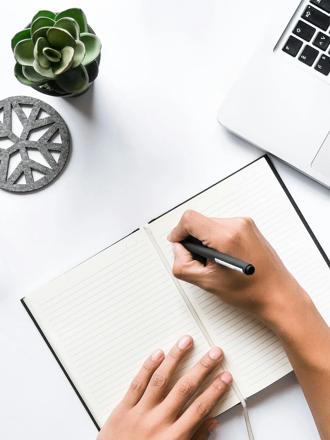 A sleek, contemporary workspace with a laptop, tablet, smartphone, and monitor. Perfect for remote work and technology-focused setups.